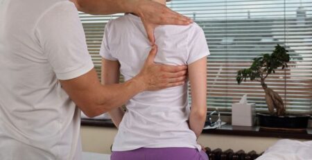 woman receives chiropractic care