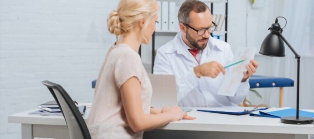 Female Patient Having Appointment at Chiropractic Clinic