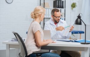 Female Patient Having Appointment at Chiropractic Clinic