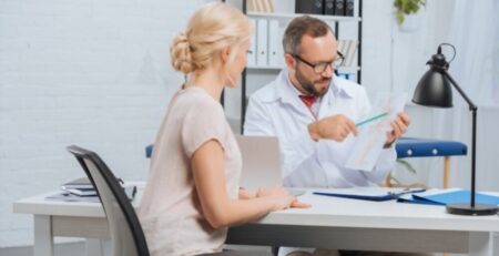 Female Patient Having Appointment at Chiropractic Clinic