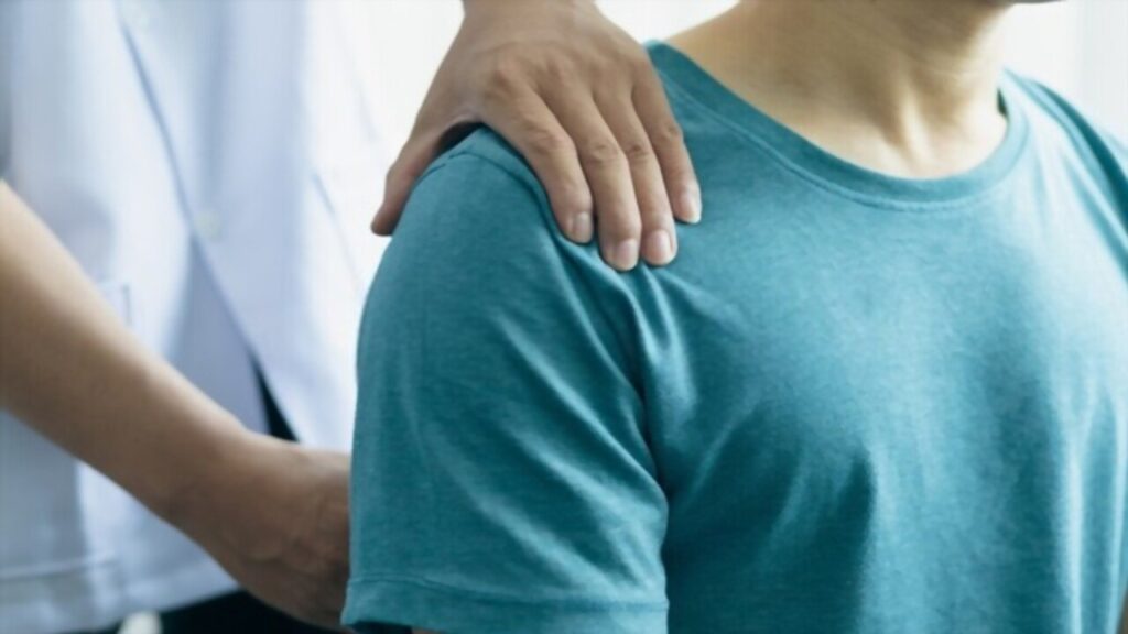 Man with Back Pain Sees a Chiropractor